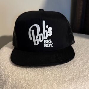 The Classic Black Mesh Trucker Hat with Gold Logo